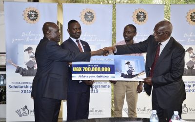 Gerald Ssendawula, the Chairman Madhvani Foundation officially hands over a placard unveiling the 2018/2019 scholarship fund worth ugx 700 million to Hon. Anthony Butele, the chairman of the scholarship committee at Madhvani Foundation (Left). Looking on is Dr. Richard Mugahi, Chairman Alumni Committee (2nd left) and Mr. Innocent Agonza (2nd Right), a 2009 beneficiary of the Madhvani Foundation. This year’s scholarship programme which was launched at  Madhvani head offices calls for university student applications in sciences including Agriculture, Biology, Chemistry, Actuarial Science, and Architecture. Veterinary Medicine, 1/2 ....2/2 Commerce, Hotel Management, Pharmacy, Nursing, Engineering, Food Science & Technology, Information Technology, Environment, and Medicine.